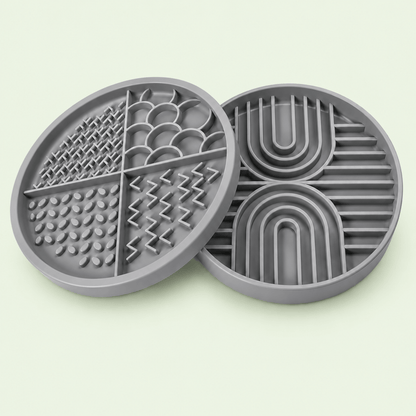 Gray Woopsi Nuzzle Duo Bowl 2-in-1 set displaying the 4-zone silicone licking mat lid next to the maze slow feeder bowl.