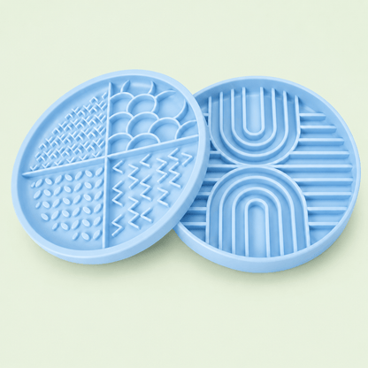 Light blue Woopsi Nuzzle Duo Bowl 2-in-1 set displaying the 4-zone silicone licking mat lid next to the slow feeder bowl.